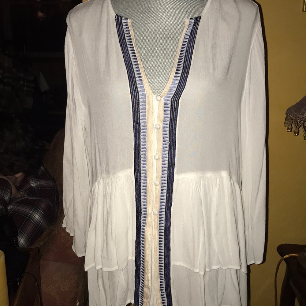 A white embroidered ruffle top